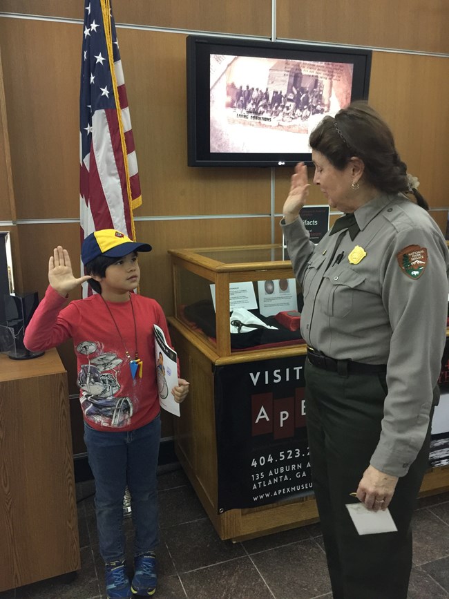 William Kai swearing in as a Junior Ranger at Martin Luther King Jr. National Historical Park