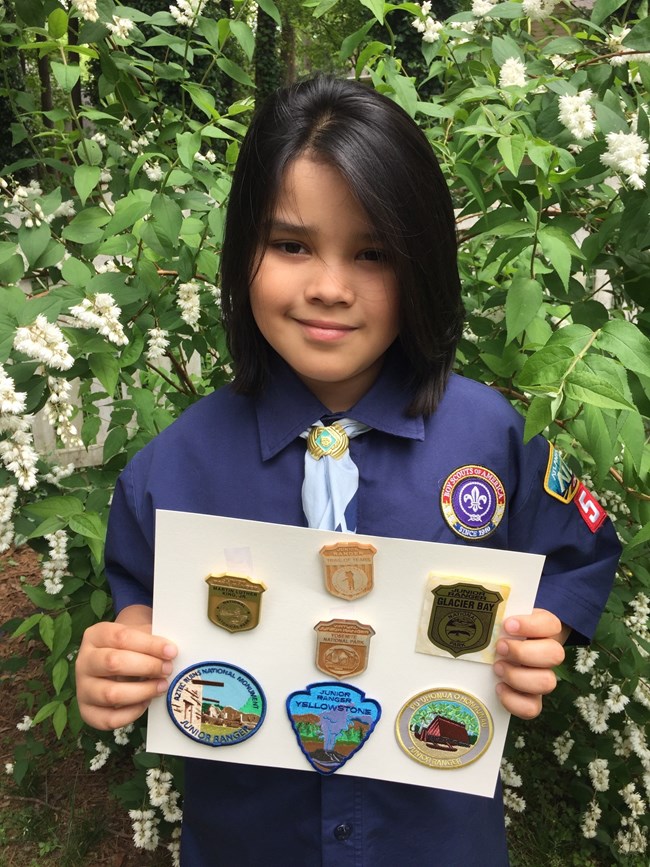 William holding up Jr. Ranger badges Will holding up Junior Ranger badges