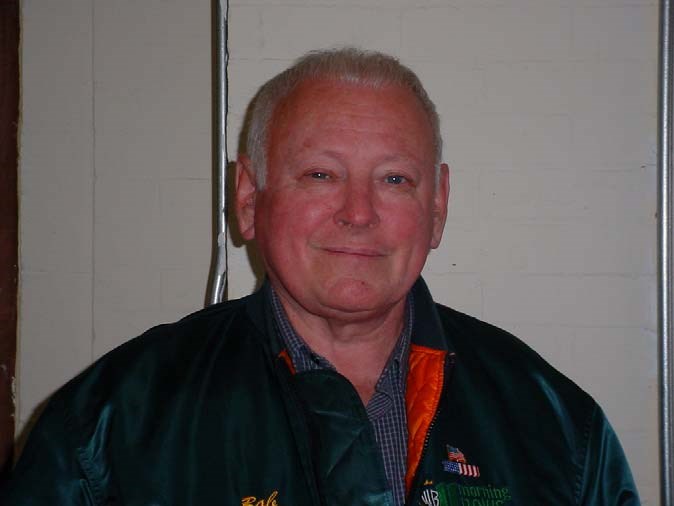 a man with gray hair smiles