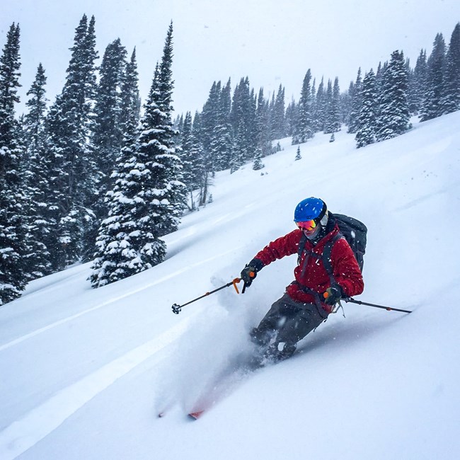 Backcountry skiing Visitor backcountry skiing in the mountains