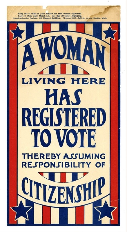Window poster that reads "A Woman Living Here has Registered to Vote Thereby Assuming Responsibility of Citizenship"