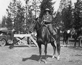 Ranger Frieda B. Nelson in uniform sitting on horseback