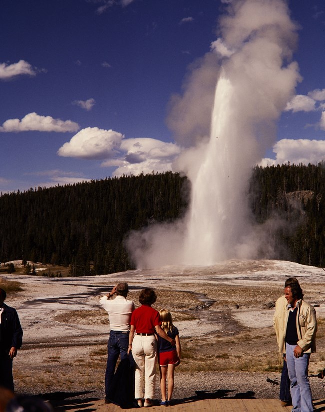 Historic photo of the Carter family visiting a geyser