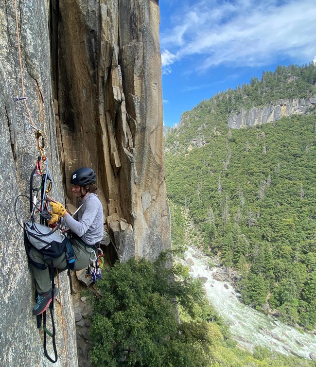 A climber on a cliff.