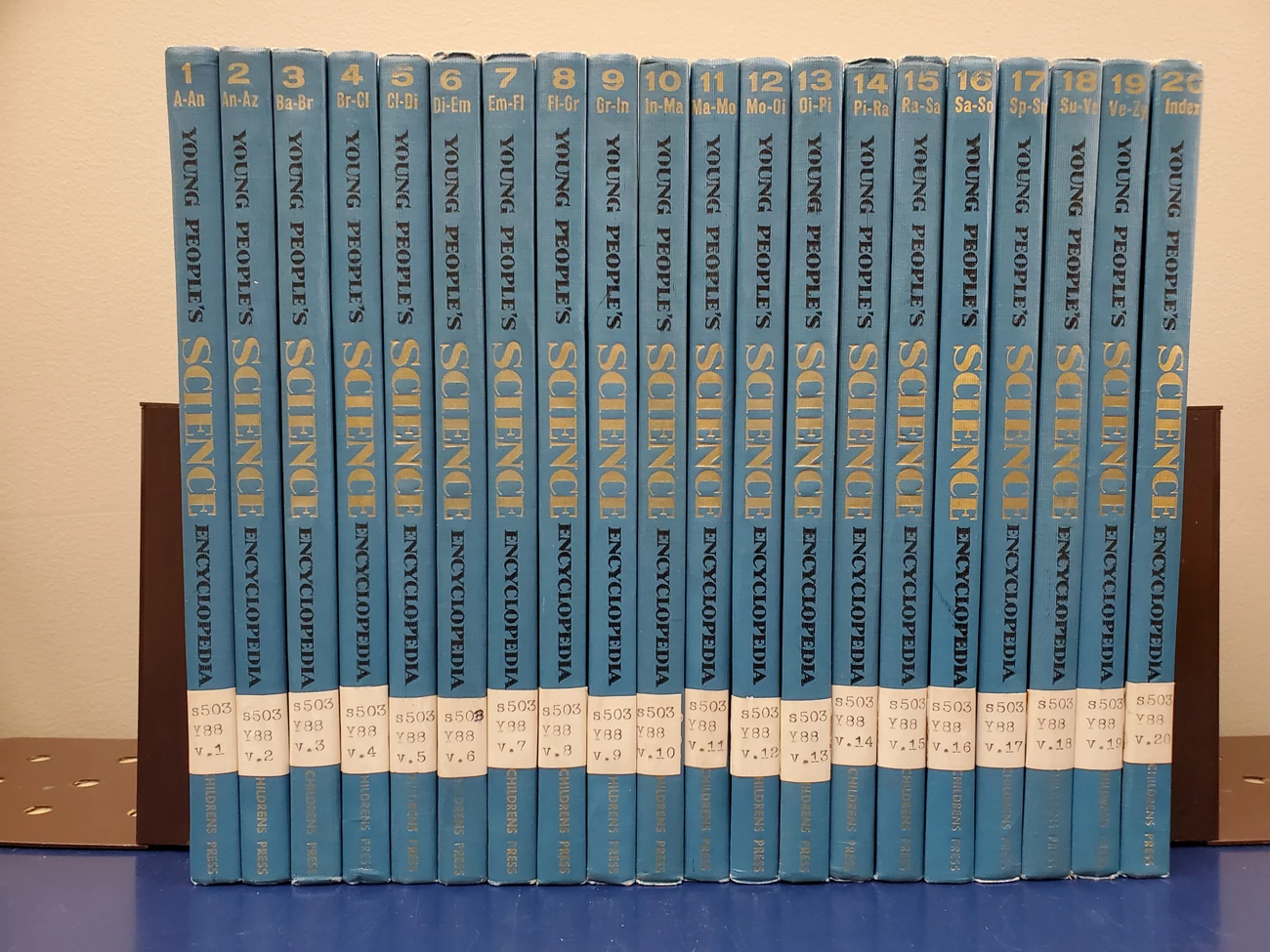 An encyclopedia set from the 1960s. The books are blue, and the spine reads Young People's Science Encyclopedia. An encyclopedia set from the 1960s. The books are blue, and the spine reads Young People's Science Encyclopedia.