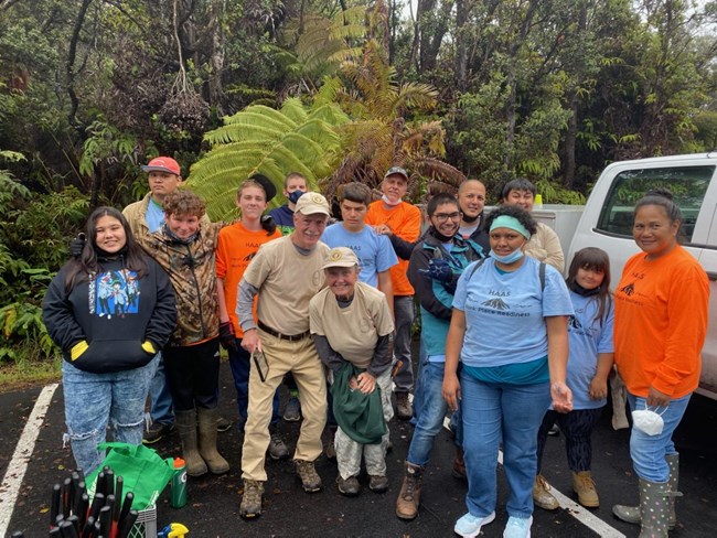 A group photo of volunteers standing next to each other at Hawaii Volcanoes National Park