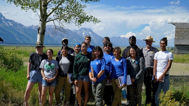 A group of students and staff pose for a group picture