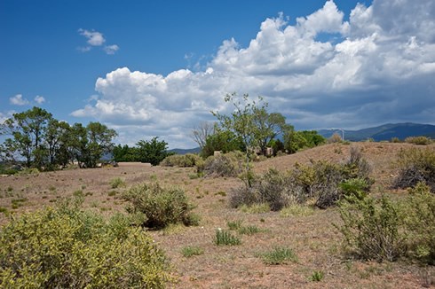 Earthen mounds trace the outlines of the former Fort Marcy, constructed in 1846 as a star-shaped adobe garrison surrounded by an eight-foot-deep moat. Photo © Jack Parsons