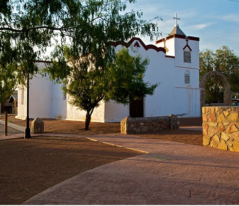 The Catholic Church of Nuestra Señora de la Candelaria (Our Lady of Candelaria), also known as Nuestra Señora de la Purificación (Our Lady of Purification), has been the spiritual hub of Doña Ana since church construction began in 1852. Photo © Jack Parso