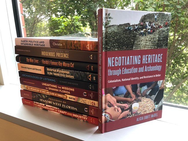 a selection of UPF's archaeology and heritage studies books Display stack of books on archaeology