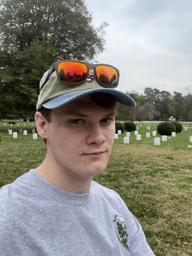 Alex Crawford A selfie of a young man with an NPS hat on.