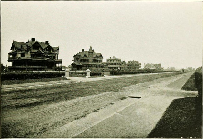 large homes along a dirt road