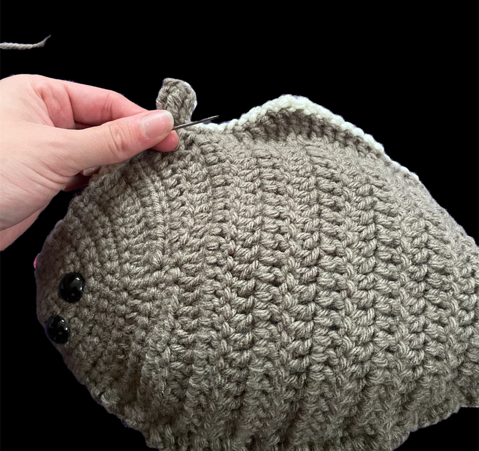 lt= Zoomed in view of bottom fin on crocheted halibut.