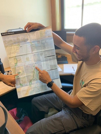 man holding a map of biscayne national park