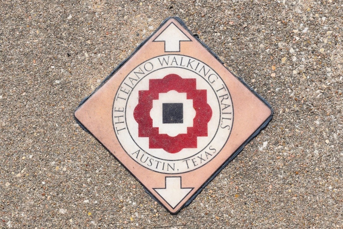Wayfinding signage is embedded in the sidewalk along the Tejano Trails. National Park Service photo. Wayfinding signage is embedded in the sidewalk along the Tejano Trails. National Park Service photo.