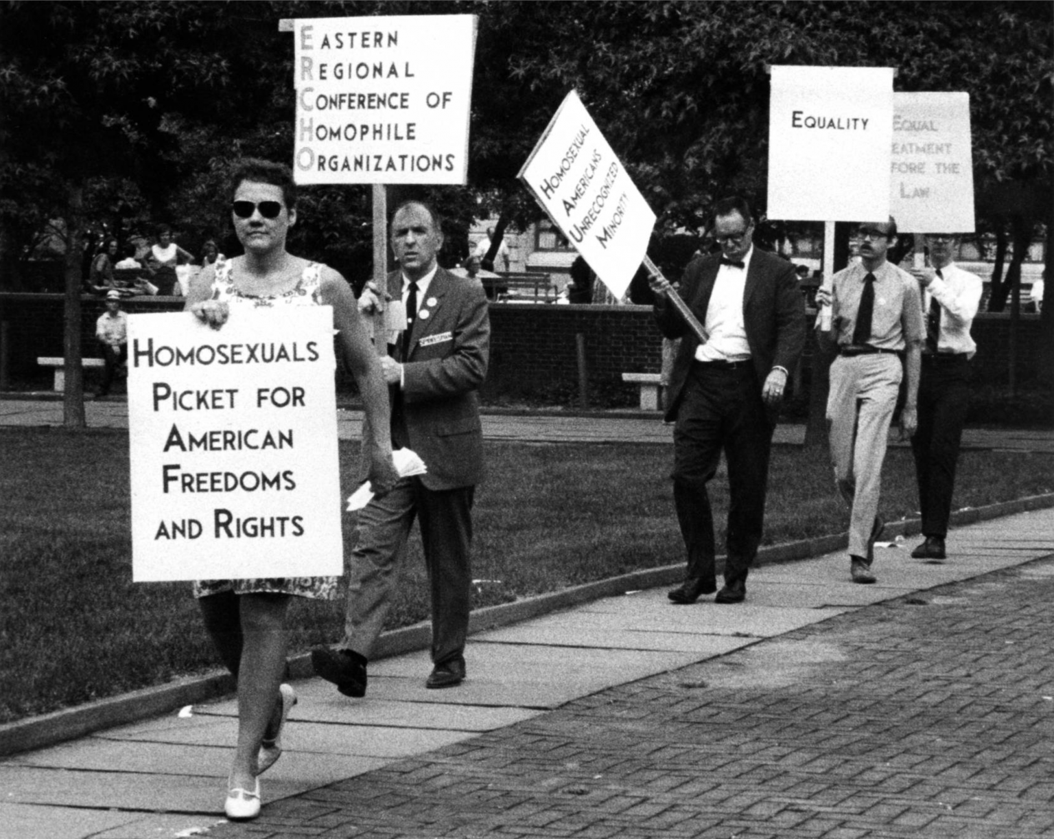 People marching with signs about LGBTQ rights