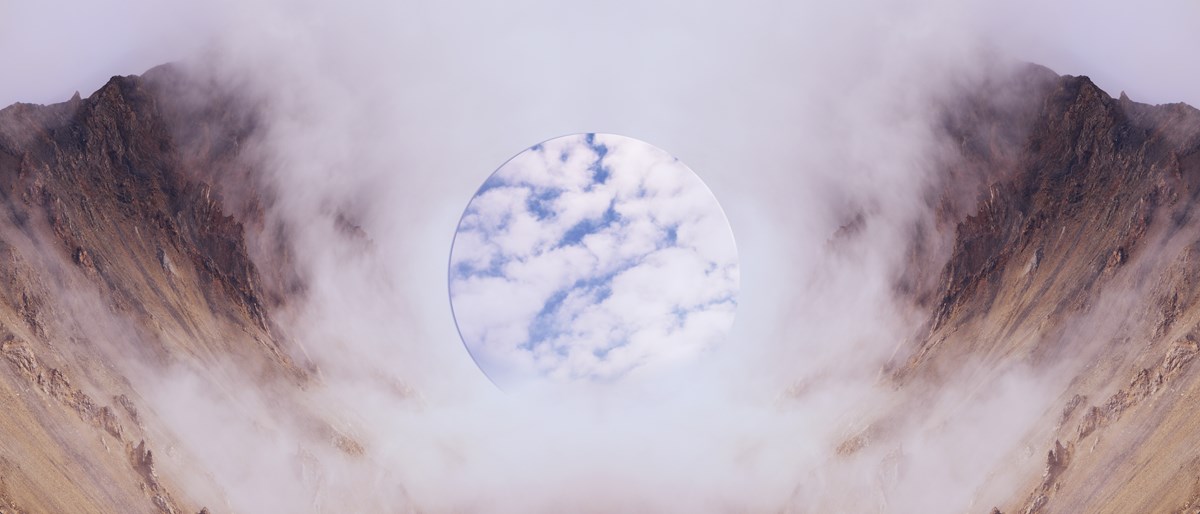 A symmetrical imaginary landscape. On the left and right sides are steep brown rocks with wispy white clouds, each a mirror image of the other. In the middle is a circle with blue skies and puffy white clouds.
