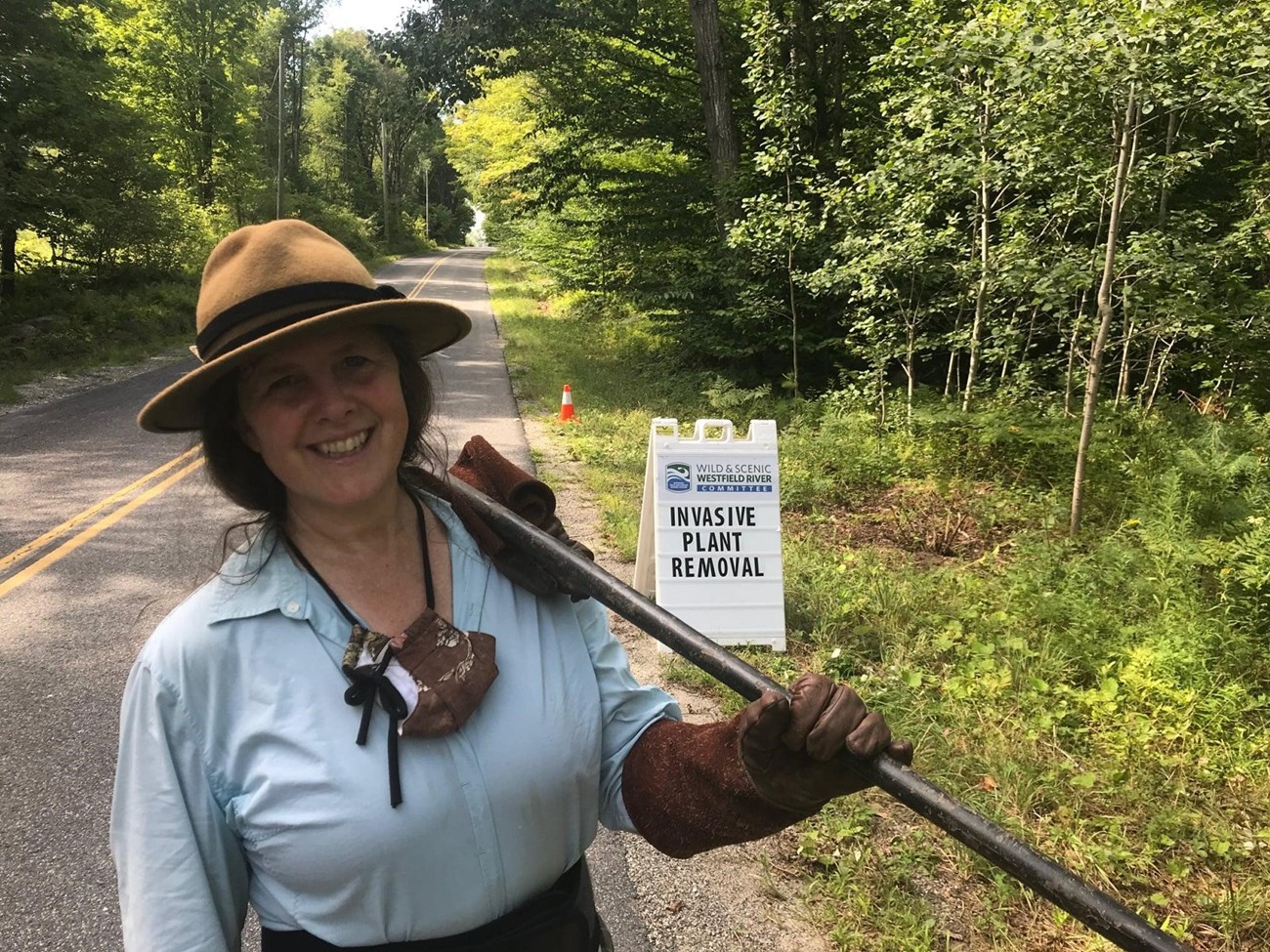 Meredyth Babcock is all smiles after a day of hard work removing invasive plants. These types of workdays are important so that native plants are not outcompeted by invasive species. Photo Credit: Westfield Wild and Scenic River Facebook page.