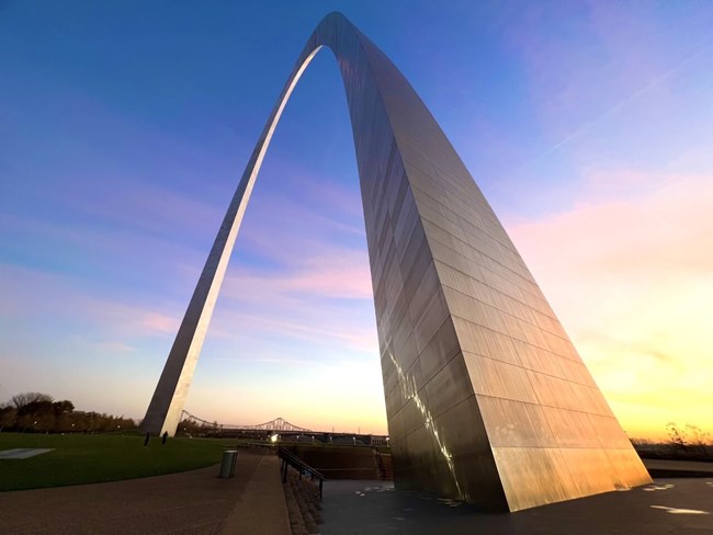 Wide angle shot of the Gateway Arch with the sunrise reflecting on the south leg. Wide angle shot of the Gateway Arch with the sunrise reflecting on the south leg.