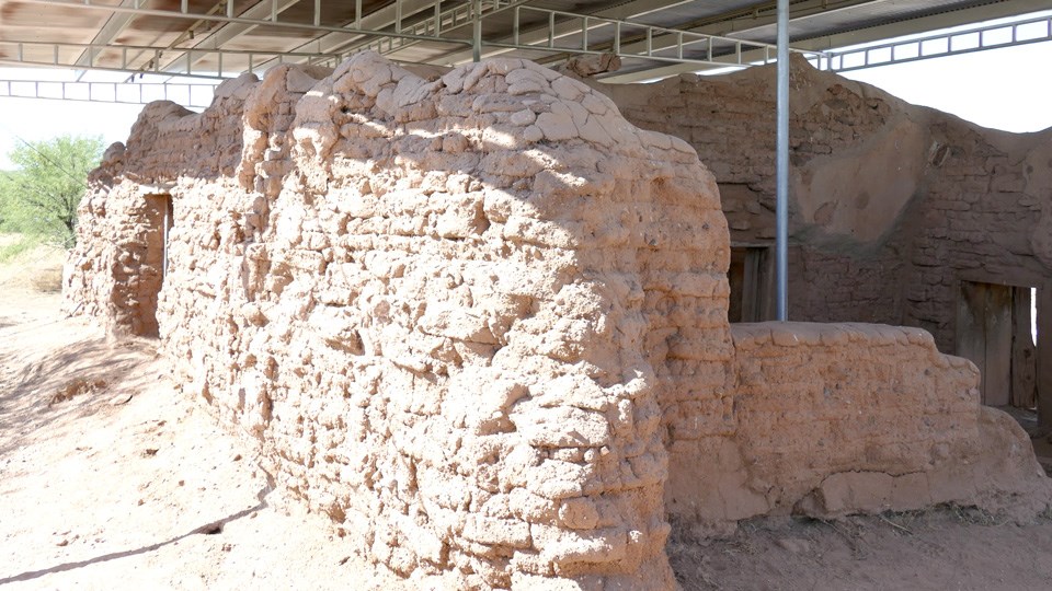 adobe ruin with rough surface on exposed bricks