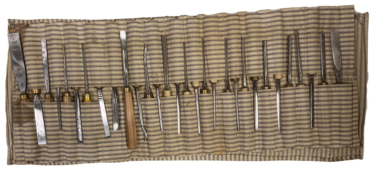 Chisels in a blue and white striped cloth case