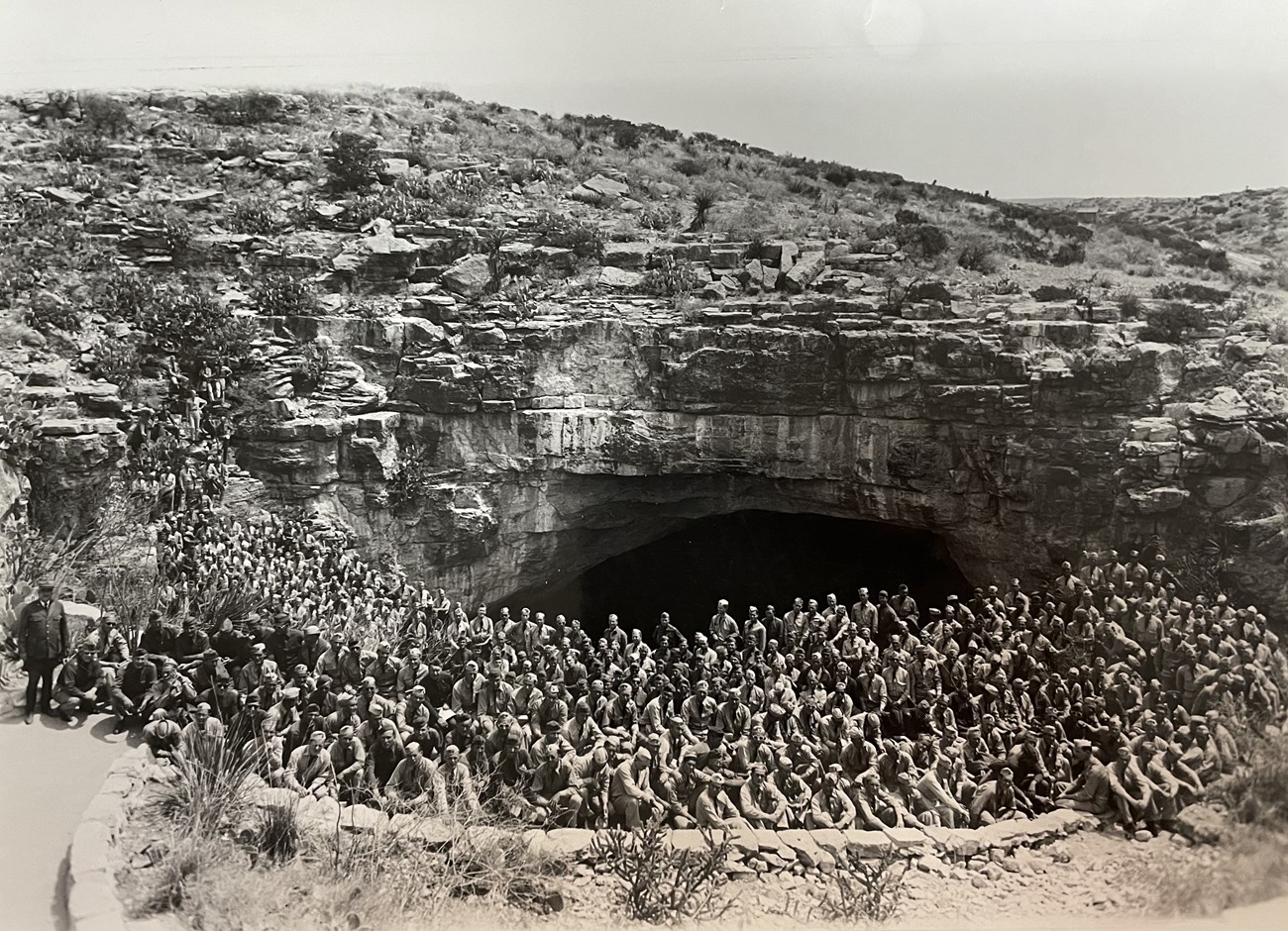 Dozens of soldiers pose for a picture in front of Carlsbad Caverns