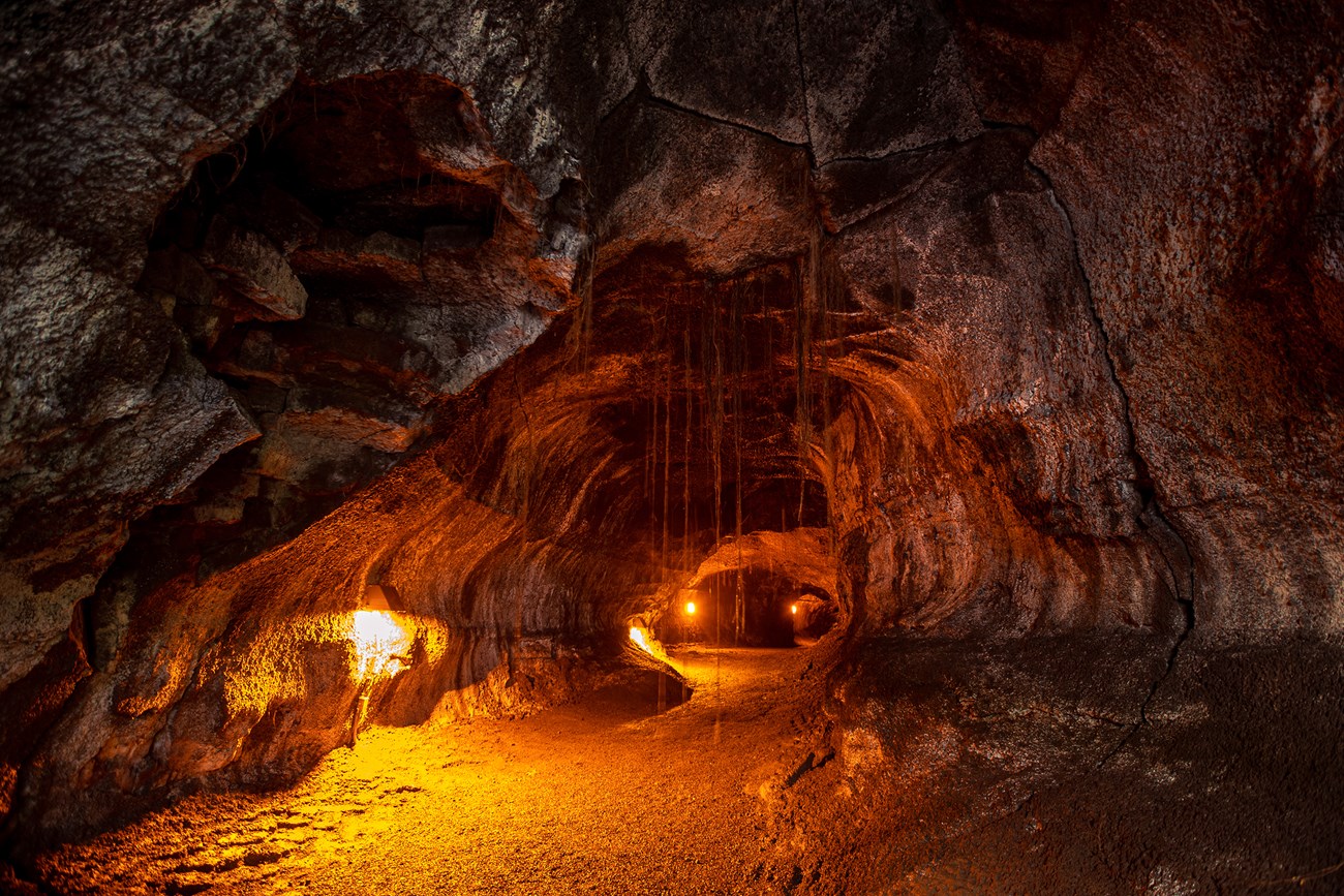 photo of the inside of a lava tube with electric lights