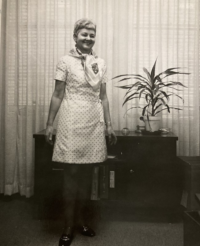 Esther Dezendorf in a polka-dot dress and scarf