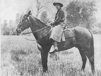 Side view of Clare Hodges on her horse.