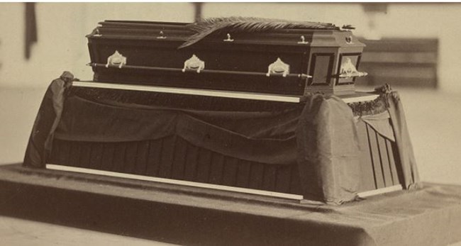 black and white photo of a coffin
