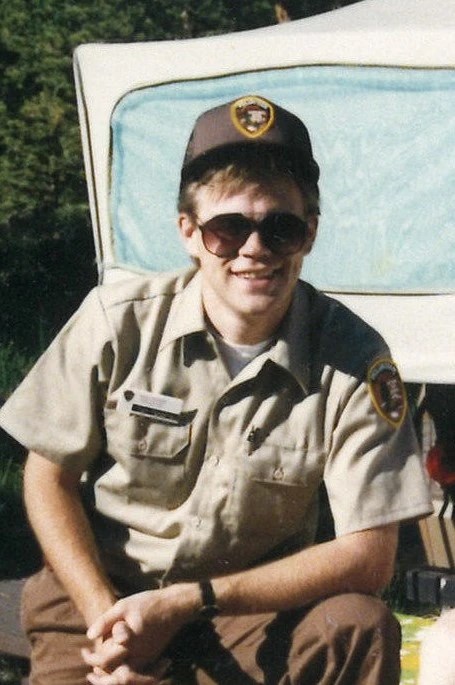 Tom Medema at the Rocky Mountain National Park, smiling for a photo while wearing a volunteer uniform.