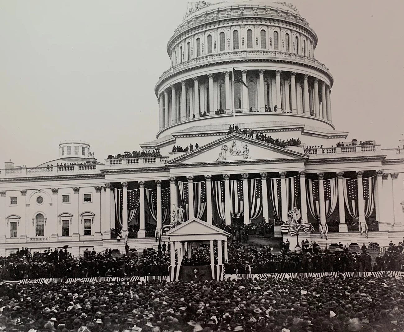 President McKinley's inauguration Large crowd in front of a flag-bedecked US Capitol building.
