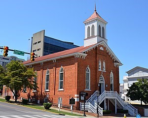 Exterior photo of a brick church.