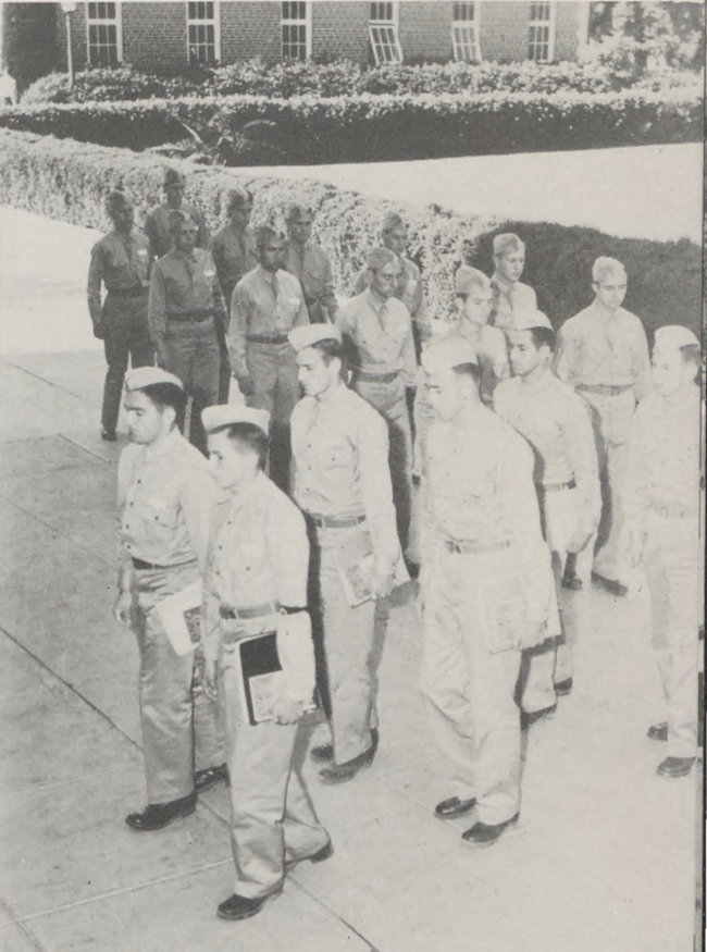 Black and white photograph of military students marching in uniform to class at the Arizona State Teachers College, 1943.