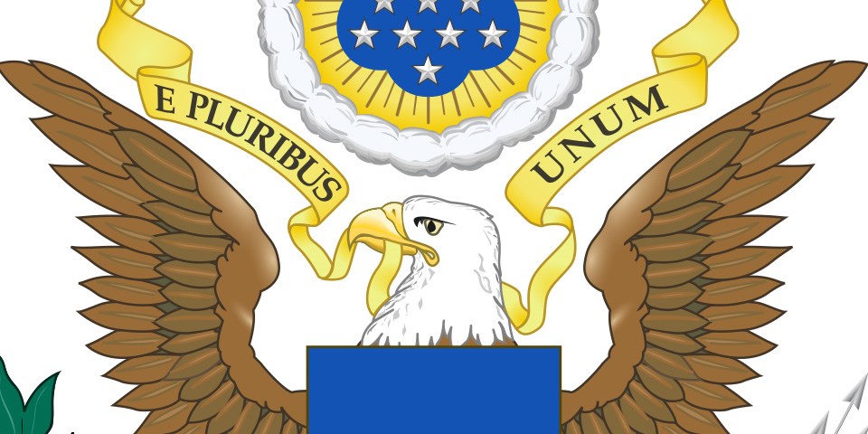 Greater coat of arms of the United States Bald ealge's head with a banner in its beak.