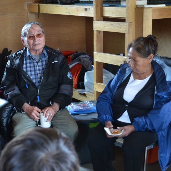 Elders tell stories to youth.