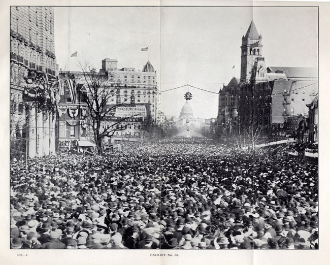 Huge crowds of people block the 1913 suffrage procession. National Archives Coll.