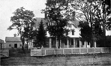 fence2 black and white photo of a farm house with a front porch