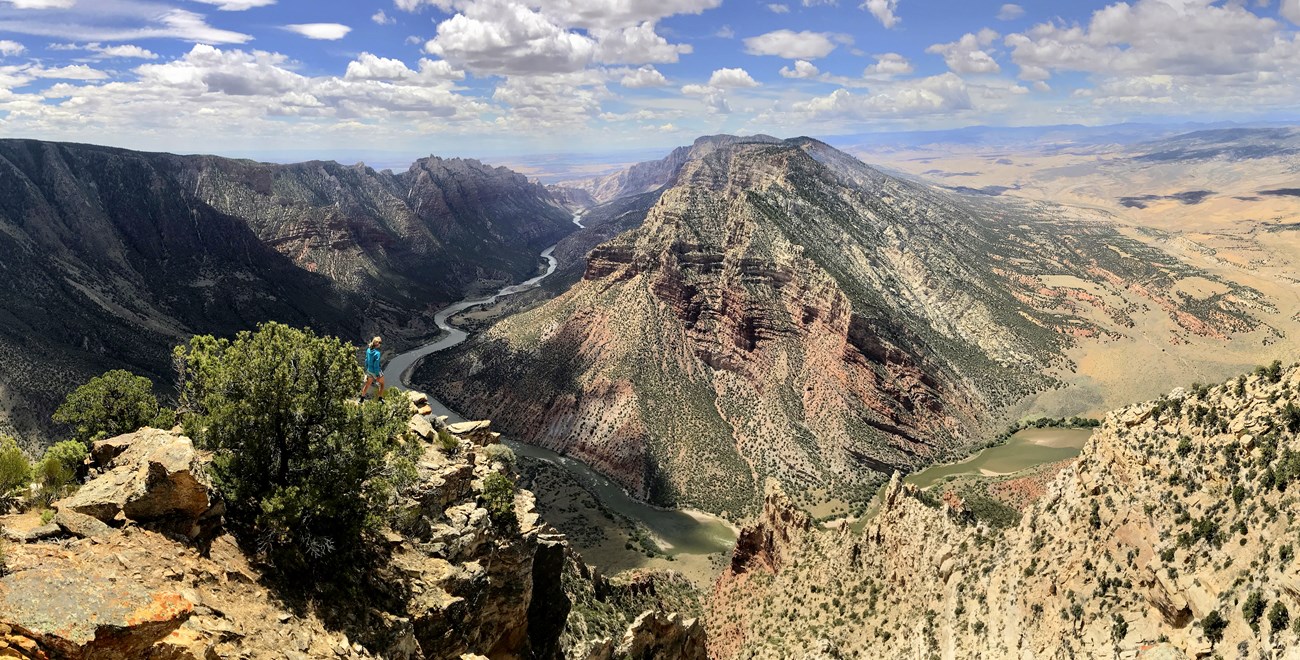 Ruple point at Dinosaur NM Overlook at Ruple Point with hiker and view of Green River winding through Dinosaur National Monument.
