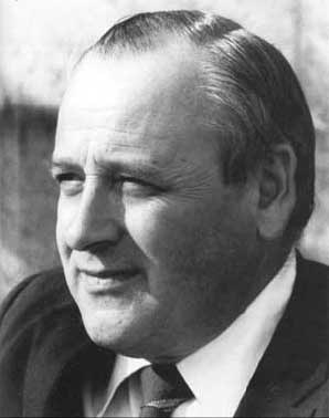 fig-4 portrait-style photo of a man in a suit