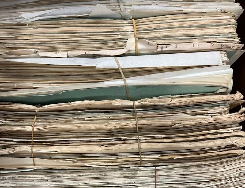 Rubber bands around archival documents Rubber bands around archival documents