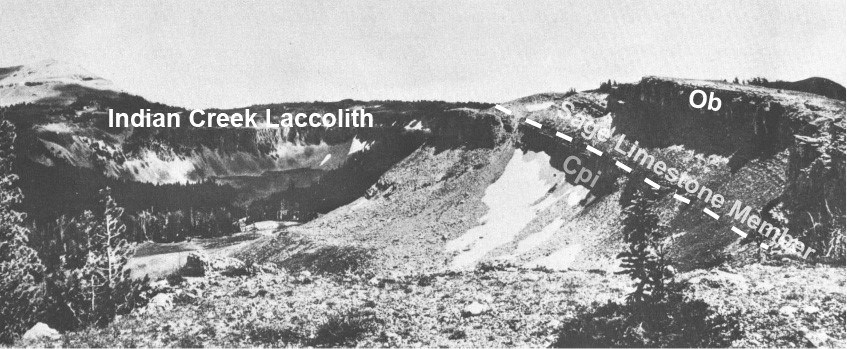 old black and white photo of rocky cliffs and patches of snow at timberlind