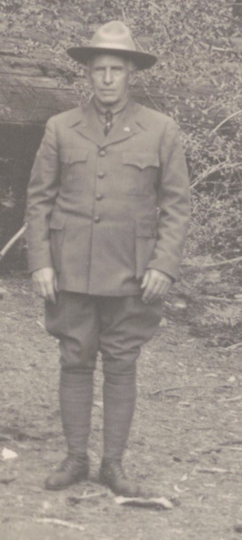 Walter Fry standing in his NPS uniform with spiral puttees on his legs