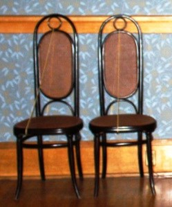 two wicker chairs setting next to each other