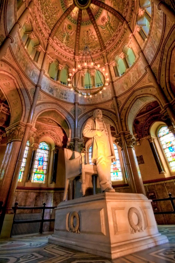 a large white marble statue of President Garfield inside the masoleum