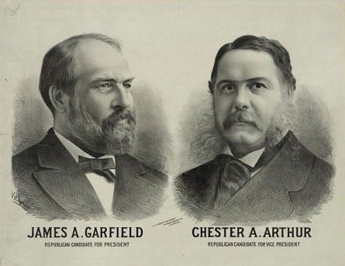 portrait of two men in suits facing each other