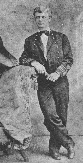 Young Giles Harber young man leaning on a chair