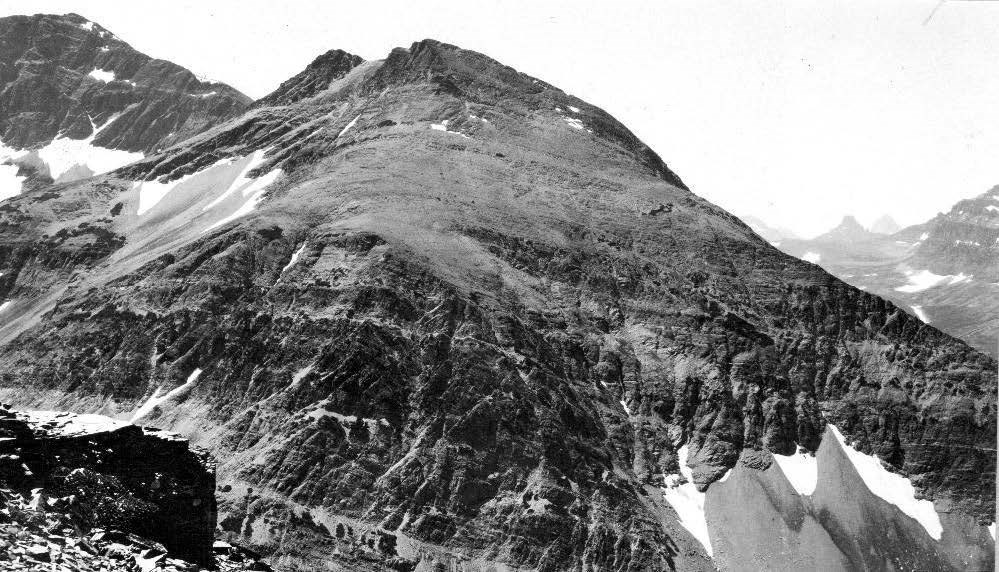 black and white photo of a rugged mountain with no trees