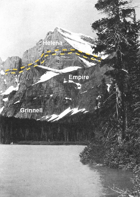 black and white photo of a lake and a distant mountain