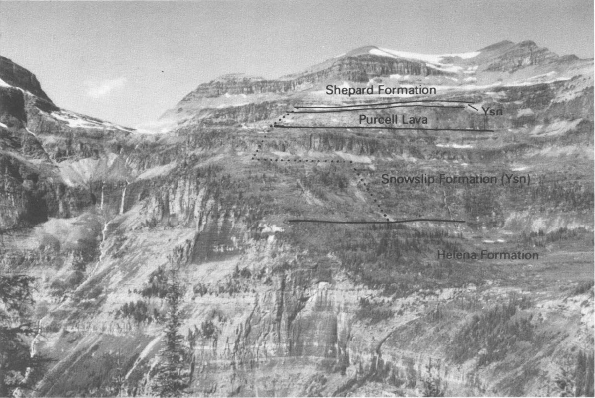 black and white photos of mountain with banded cliffs